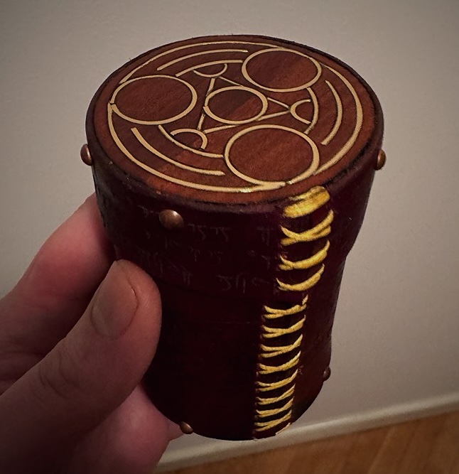Top view of the Arcana leather dice cup showing the engraved arcane circle sigil